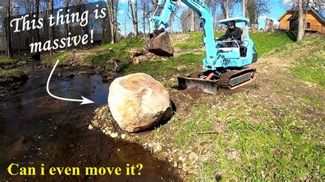 mini excavator move rocks|Moving a big boulder with a mini excavator .